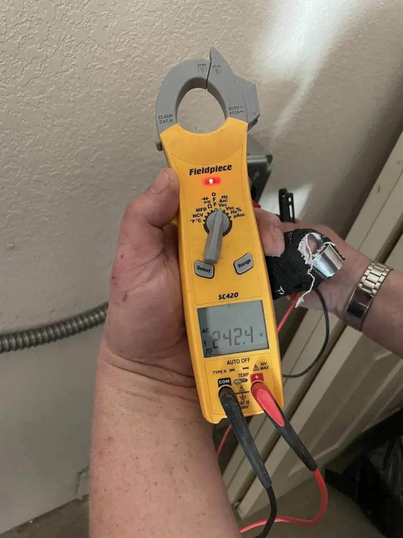 Voltage testing with clamp meter during Ceiling Fan Installation in The Crossings